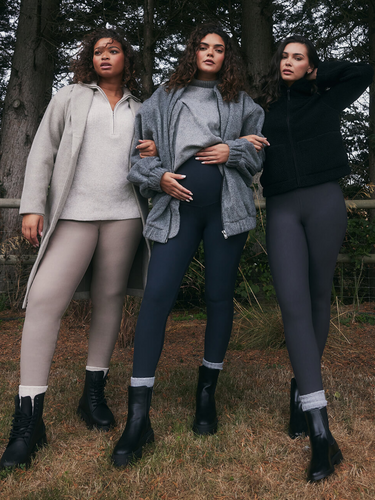 Three models wearing Everyday Winter Leggings and Extreme Fleece Lined Leggings from LOVALL. They are outside, in the woods and wrapped up in layers of warm clothing.